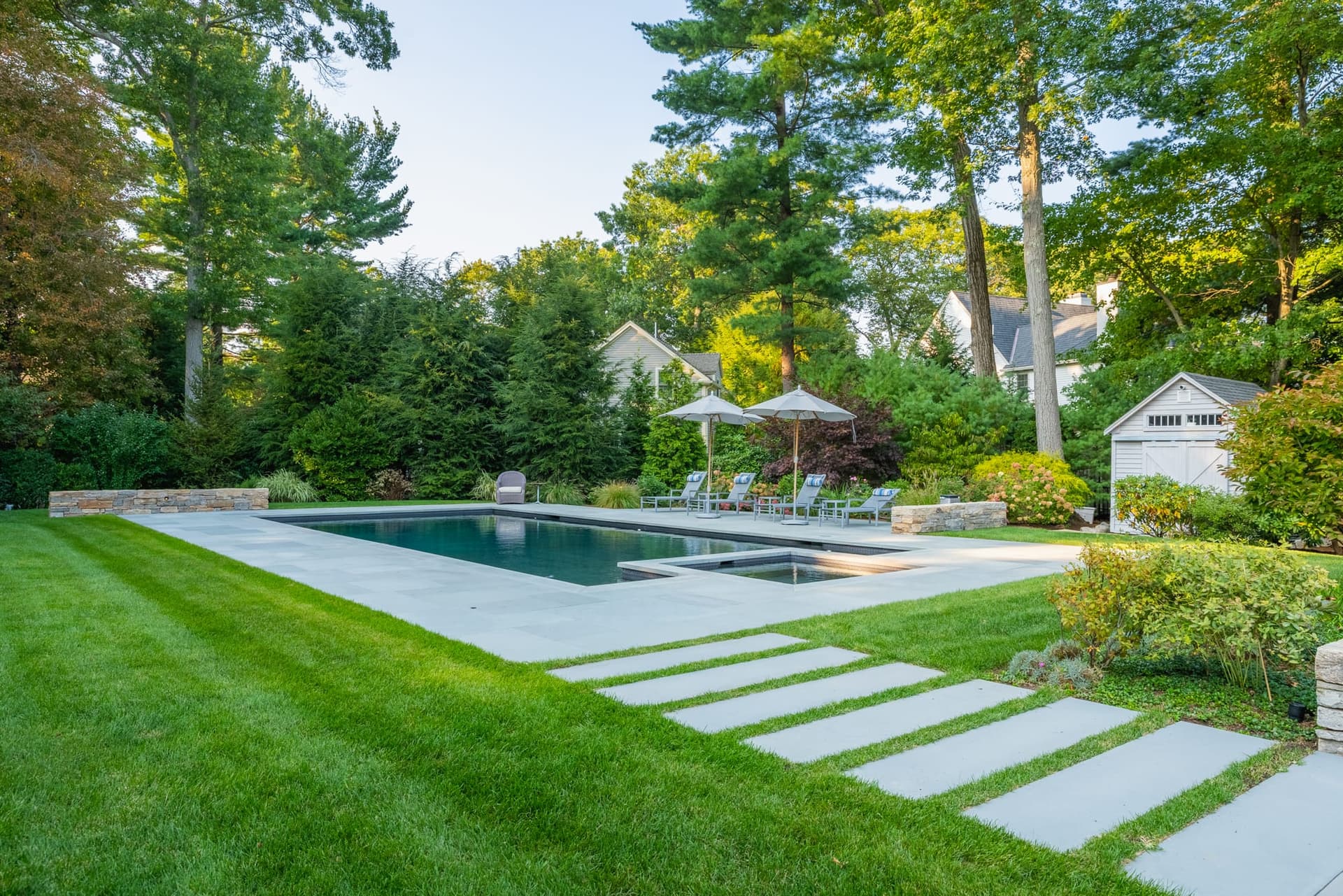 Cornell Road — bluestone steppers set into lawn beside the pool in Wellesley, MA