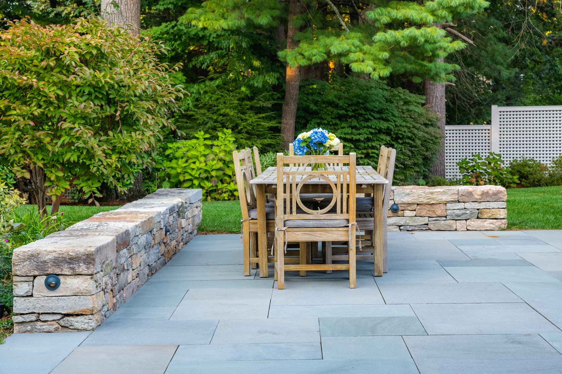 Cornell Road — granite seat walls around the bluestone dining terrace in Wellesley, MA