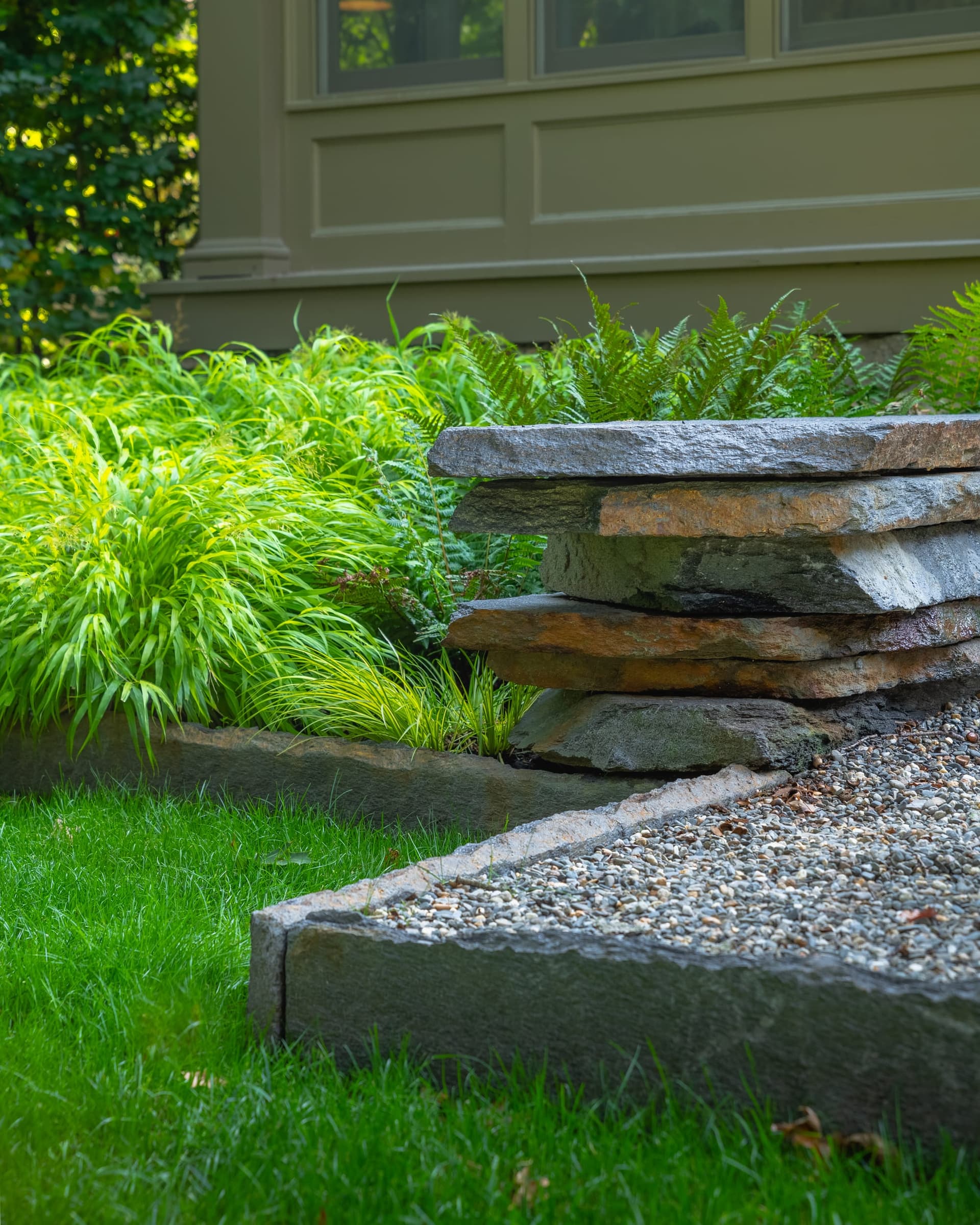 Circuit Road — stacked-stone water feature at the garden edge in Chestnut Hill, MA