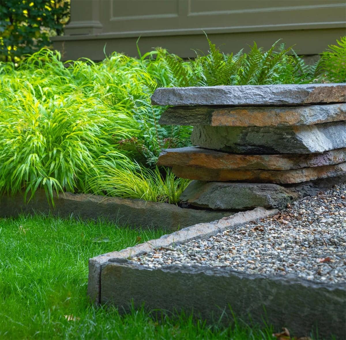 Hand-set stone steps with granite edging and ferns in Chestnut Hill, MA