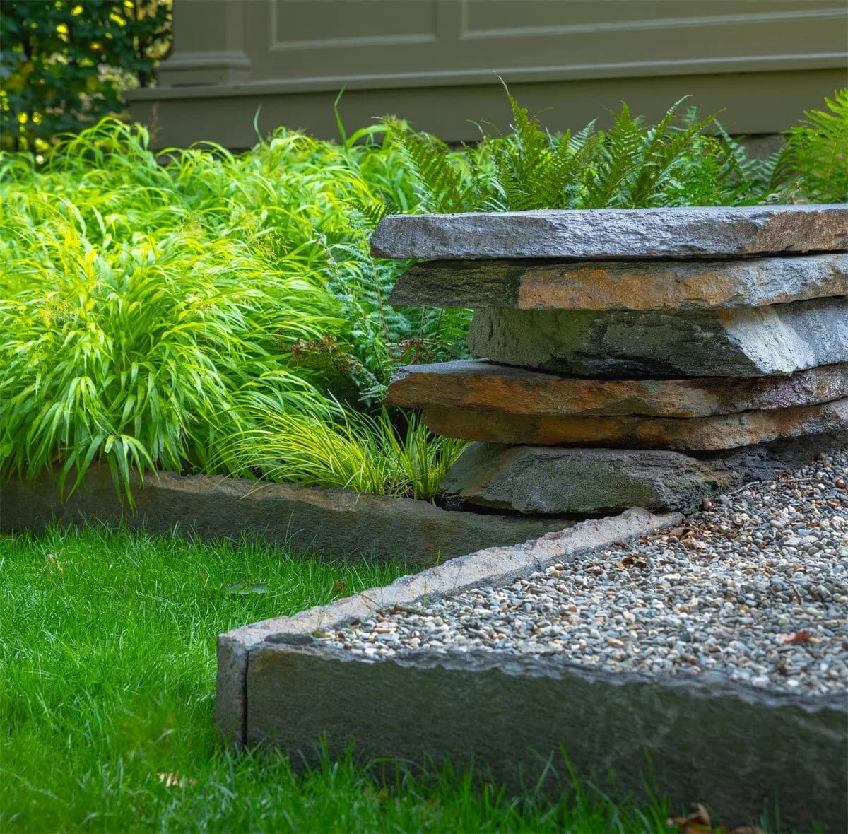 Hand-set stone steps with granite edging and ferns in Chestnut Hill, MA