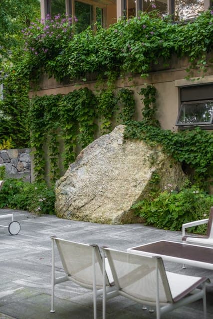 Natural boulder feature beside the terrace in Wellesley, MA