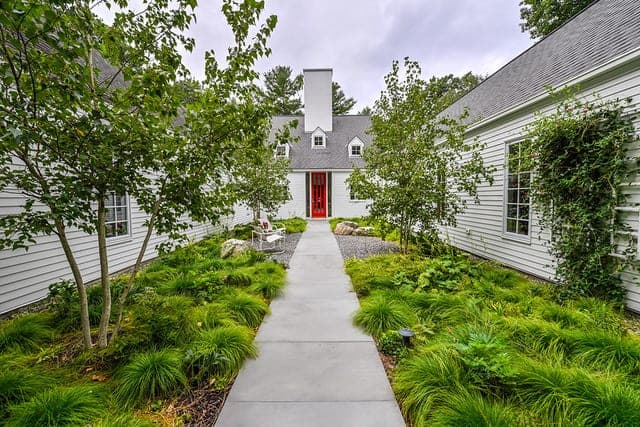 Stone walkway leading to the front door of a home in Weston, MA