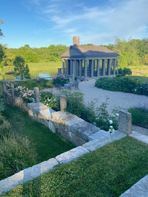 Granite Terraces — granite retaining wall along the gravel garden path in Westport, MA