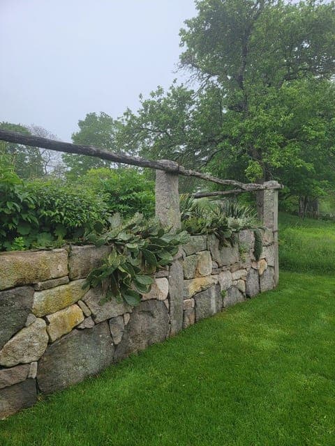 Granite Terraces — dry-laid granite wall with granite posts in Westport, MA