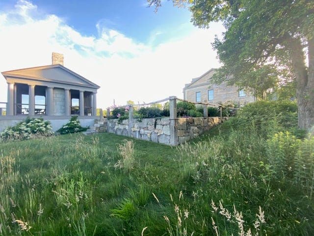 Granite Terraces — granite walls terracing the slope below the house in Westport, MA