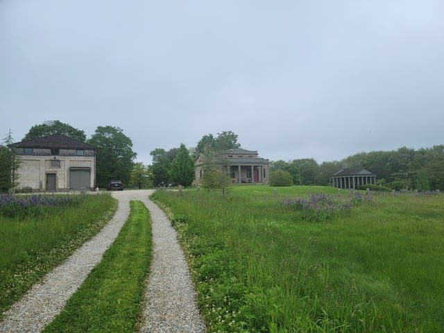 Granite Terraces — gravel drive approaching the house in Westport, MA